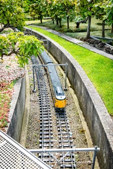 Toy train in a miniature city in Madurodam park, Netherlands.