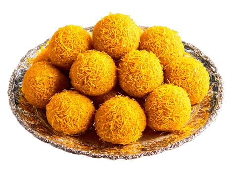 Laddu with Saffron Strands Round laddus adorned with saffron strands served on a glass platter. Food isolated on transparent background.
