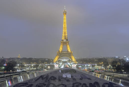 France, Paris - Jan 02, 2024 - Nice scenery of Famous Eiffel Tower with dark sky background in Paris at night. View from Trocadero view point , one of the best-known landmark and national symbols of france, Space for text, Selective focus.