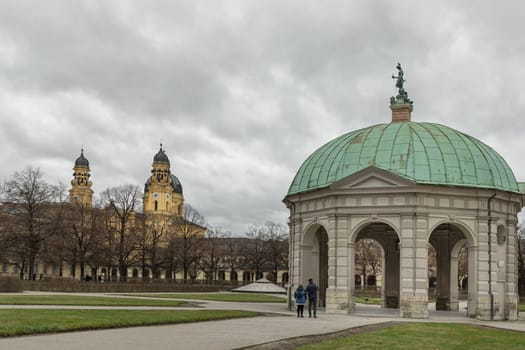 Munich, Germany - Dec 21, 2023 - View of The Diana Temple (Dianatempel) in the Munich Hofgarten at the garden of the Munich Residenz with The Theatine Church of St.Cajetan and Adelaide. Space for text, Selective focus.