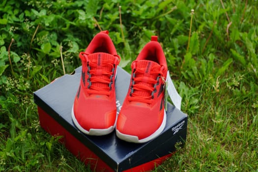Tyumen, Russia-June 20, 2024: Sneakers red Reebok men model Nanoflex EK M2.