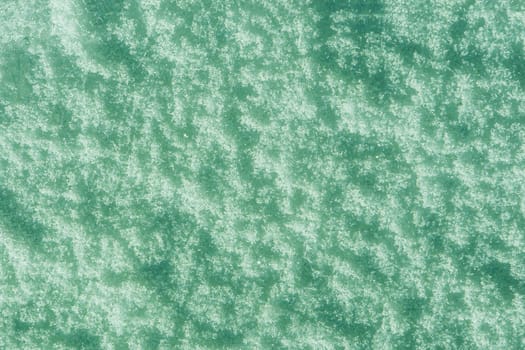 Illustration of a snow surface painted blue-green, turquoise.