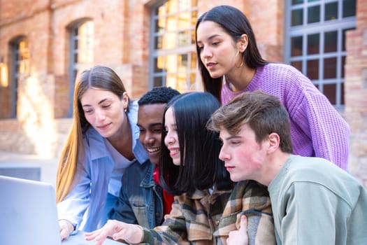 Group of students, meet on university campus work together on creative tasks, prepare for university exams, use laptop. Education, study of university life concept.