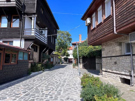 NESSEBAR, BULGARIA - March 2023: Nessebar old town street view, old stone and wooden houses in Nessebar, UNESCO Heritage site, Bulgaria. High quality photo