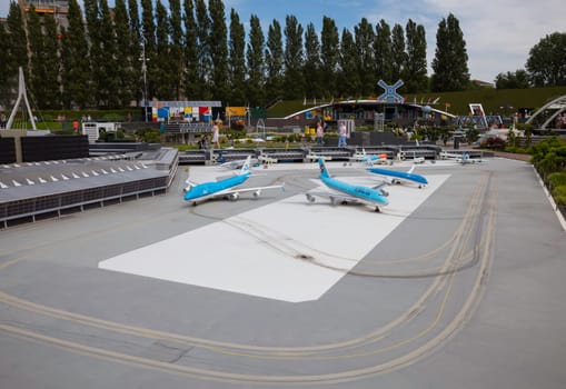 den haque,holland,9-07-2024:,Visitors enjoying the replicas of famous dutch airport schiphol as a tourist attraction in Madurodam park buildings from all parts of the Netherlands.