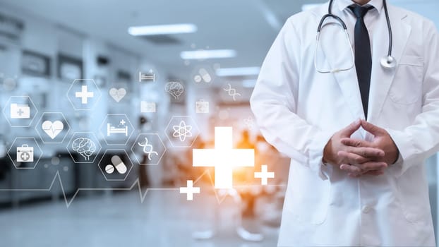 A doctor in a lab coat is standing on the background inside a hospital. Medical concept. Medical information search concept. The concept of treating disease. Insurance concept.