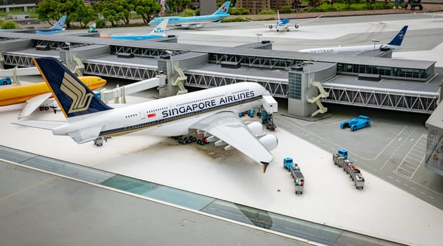 den haque,holland,9-07-2024:,the replicas of famous dutch airport with airplanes from klm and singapore as a tourist attraction in Madurodam park