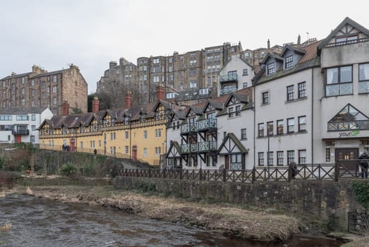 Edinburgh, Scotland - Jan 16, 2024 - Hawthorn Buildings is a traditional old Tenement building on Hawthornbank Lane in Dean Village with river and stream which sits along the banks of the Water of Leith. Space for text, Selective focus.