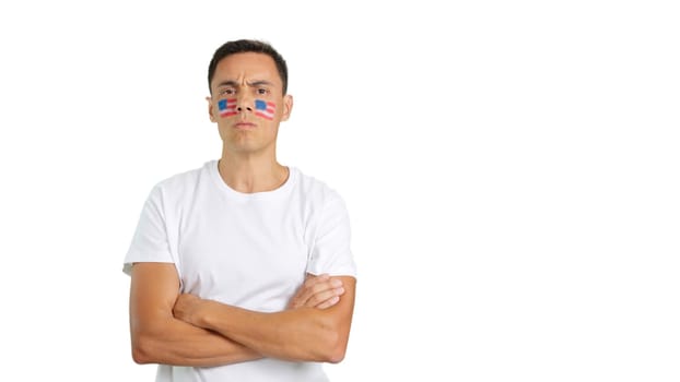 Dignified and serious man with USA flag painted on face looking the camera with dignity