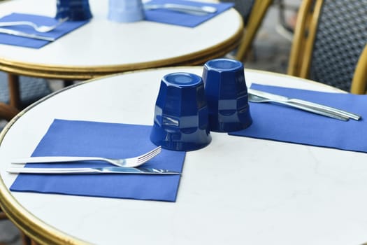 Traditional Parisian small outside cafe with chairs France