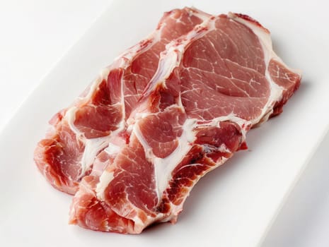 Raw meat piece isolated on white photo