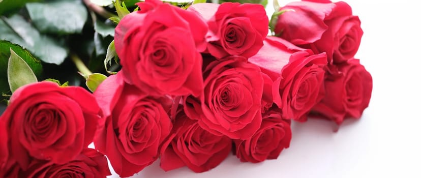 Close-up of luxury bouquet made of red roses, flower shop. Birthday, Valentines or mother's day celebration. Festive events concept