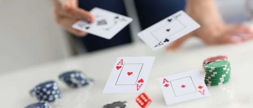 Close-up of playing cards for poker game, gamble games and casino. Profession player throwing trump out of sleeve. Strategy and business card game concept