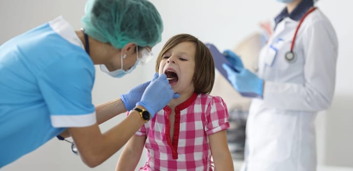 Close-up of female nurse, takes cotton bud to analyze saliva, nasal swab, mucous membrane for DNA tests. COVID-19, determination paternity or presence of virus