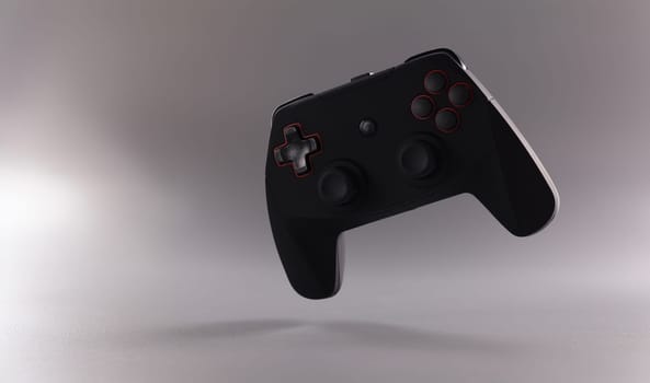Close-up of black video game joystick or gamepad on grey background. Single game console on grey background. Gamer, competition and addiction concept