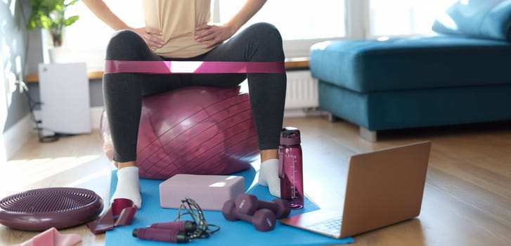 Woman doing fitness exercise online, sport workout at home. Fitness equipment for sport activity. Healthy lifestyle concept