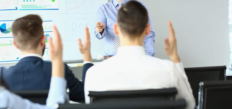 Portrait of business coach at training in company office, development strategy, teambuilding or brainstorming. Business seminar and teamwork concept
