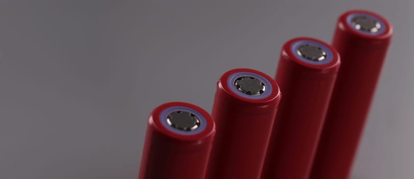 Close-up of four rechargeable batteries set, lithium battery and important power source. Battery mods with electrical energy. Power concept
