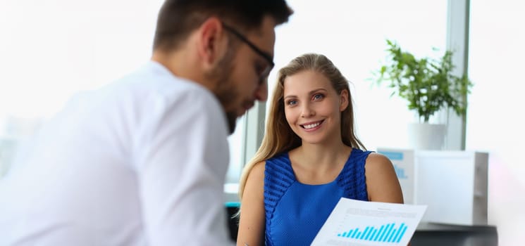 Portrait of colleagues discussing profitable of new startup, statistics data documents. Businessman studying business papers. Business meeting, partnership and development project