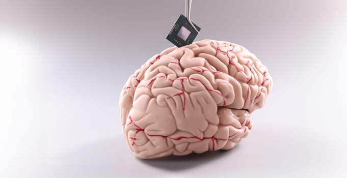 Close-up of tiny computer chip detail in human brain. Microprocessor in head. Future, modern technology and digital world concept
