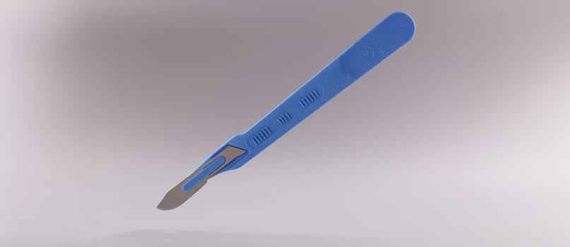 Close-up of scalpel, surgical stainless steel metal instrument on grey background. Knife with small, sharp, detachable blade, using by surgeon. Medical tools