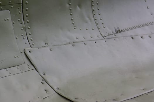 Old metal skin with rivets on an airplane.Airplane fusalage .