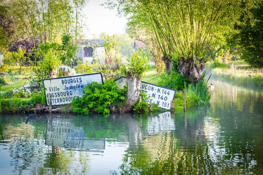 Signs in the water, marshland in Bourges, France