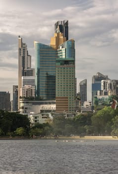 Bangkok, Thailand - 22 Jun, 2024 - Cityscape office buildings with modern architecture. Picturesque view of skyscrapers and dramatic sky before sunset, Copy space, Selective focus.
