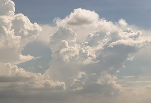 The sky is being covered with fluffy white clouds. Concept idea of Imaginative clouds nature, Amazing sky like a heaven for background wallpaper and texture, Space for text, Selective Focus.