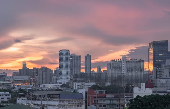 Bangkok, Thailand - May 20, 2024 - Gorgeous scenic of sunset with beautiful cloud and sky over metropolitan city. Bangkok city skyscrapers after sunset with Beautiful sky background, They can be used as Wallpaper, Copy space, Selective Focus.