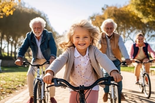 Grandparents and granddaughter smiling while riding bicycles in the park. Active seniors enjoying quality time with their grandchild on a sunny autumn day.