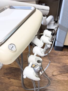 Denver, Colorado, USA-July 12, 2024-Close-up view of a tray with dental tools in a modern dental office, showcasing the organized setup and clean environment for dental procedures.