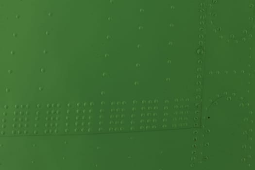 Surface of sheet metal with rivets. Airplane fuselage.