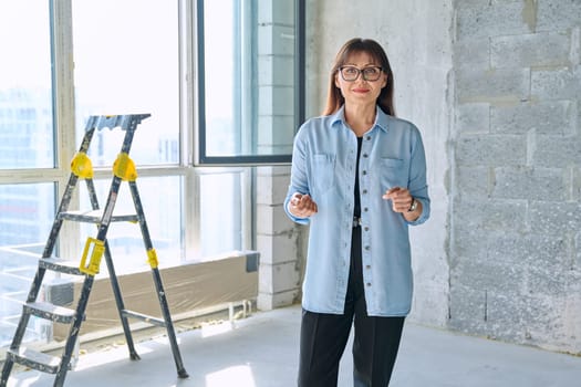Female decorator designer, repair manager, organizer of final finishing and decor in new apartment office. Repair, decoration, work, people concept