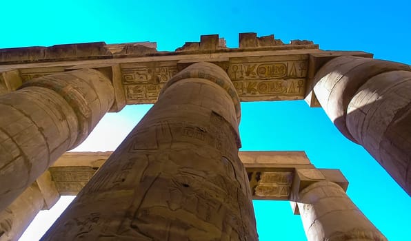 Luxor, Egypt - November 10, 2004: ancient temple columns with hieroglyphs, drawings and inscriptions at Karnak in Luxor, Egypt