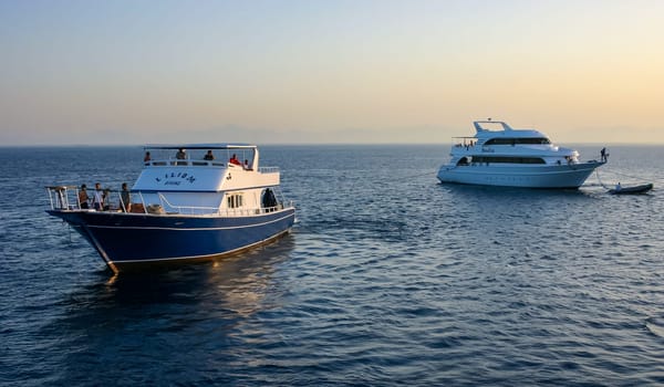 Hurhgada, Egypt - APRIL 9, 2006: Tourist diving boats anchored near a city in the Red Sea, Egypt