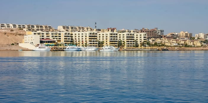 Hurhgada, Egypt - April 9, 2006: Tourist diving yachts anchored near the pier of the Egypt Hotel, Red Sea, Egypt
