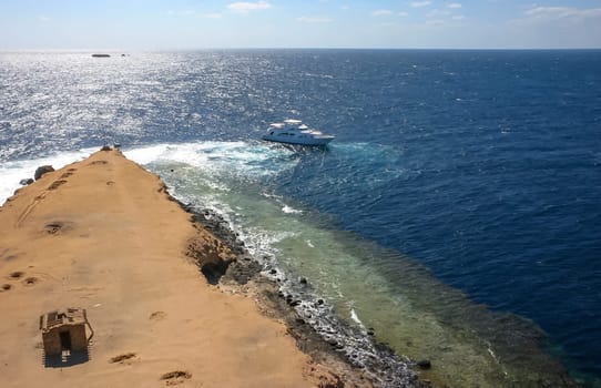 Big Brother Island, Egypt - April 10, 2007: tourist yachts near the coastal reef of Big Brother Island in the Red Sea, Hurghada area
