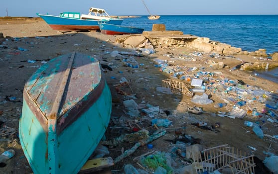 Egypt, Marsa Alam - November 01, 2007: Environment of the Red Sea,  Mountains of garbage on the beach away from the resort towns of Marsa Alam, Egypt