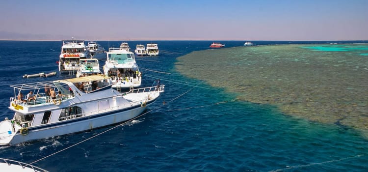 Hurghada, Egypt - October 26, 2008: tourist diving yachts moored to a coral reef in the Red Sea