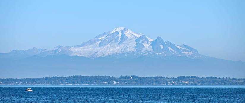 Beautiful view of mountain Baker from the Tsawwassen bech in the evening time.