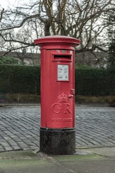 Edinburgh, Scotland - Jan 19, 2024 - Retro Royal Mail Red Post Box. Traditional post boxe, Red Postbox, Great Britain, Space for text, Selective focus.
