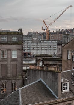 Edinburgh, Scotland - Jan 19, 2024 - View of urban brick buildings and Leonardo royal hotels with sky background in central Edinburgh. Destinations in Europe, Space for text, Selective focus.
