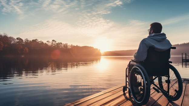 Wheelchair bound person admiring serene lakeside sunset, tranquility and resilience in natures beauty