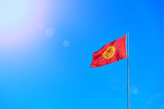 National Kyrgyzstan flag on Bishkek central Ala-Too square.