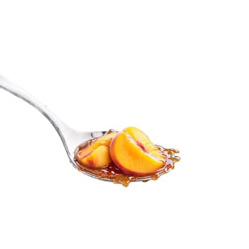 Peach preserves spread chunky and glistening cascading off a spoon with peach slices and syrup. Food isolated on transparent background.