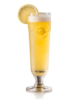 German Radler in tall glass garnished with slice of lemon and few ice cubes. Drink isolated on transparent background.