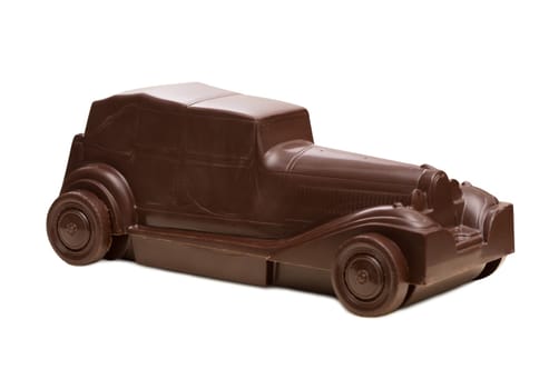 Retro car made of dark chocolate, isolated on white