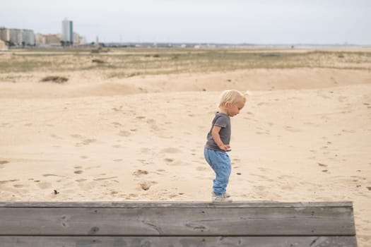 a cute girl walking on the sand beach
