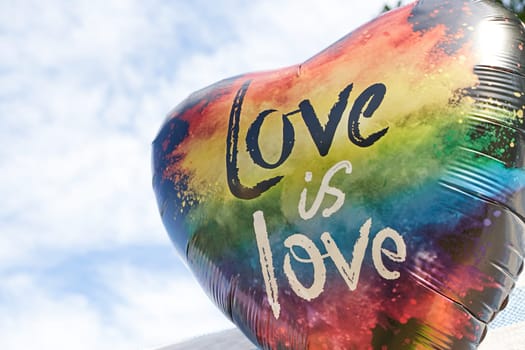 Foil balloon heart and the inscription love is love . Holiday. Love. Congratulation